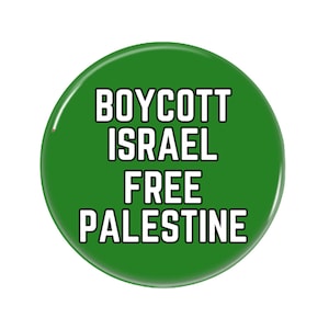 May include: A green round button with white text that reads "BOYCOTT ISRAEL FREE PALESTINE".