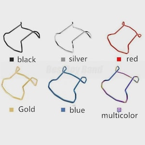 May include: A collection of six metal frames in various colors: black, silver, red, gold, blue, and multicolor. Each frame has a unique shape and is displayed against a light background. The colors are labeled below each frame.