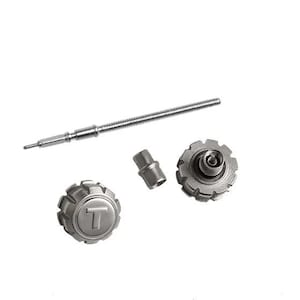 May include: A set of watch repair tools, including a stem, a crown, and a case back tool. The tools are made of metal and have a silver finish.