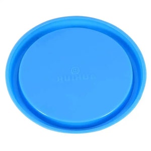 May include: A blue plastic lid with a raised rim and a small, white logo that says "Rimul" with a circled "R" in the center.