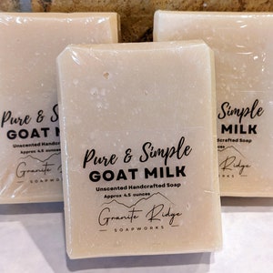 May include: Three bars of unscented goat milk soap, each wrapped in plastic and labeled "Pure & Simple Goat Milk" with a mountain range logo and the text "Granite Ridge Soapworks".