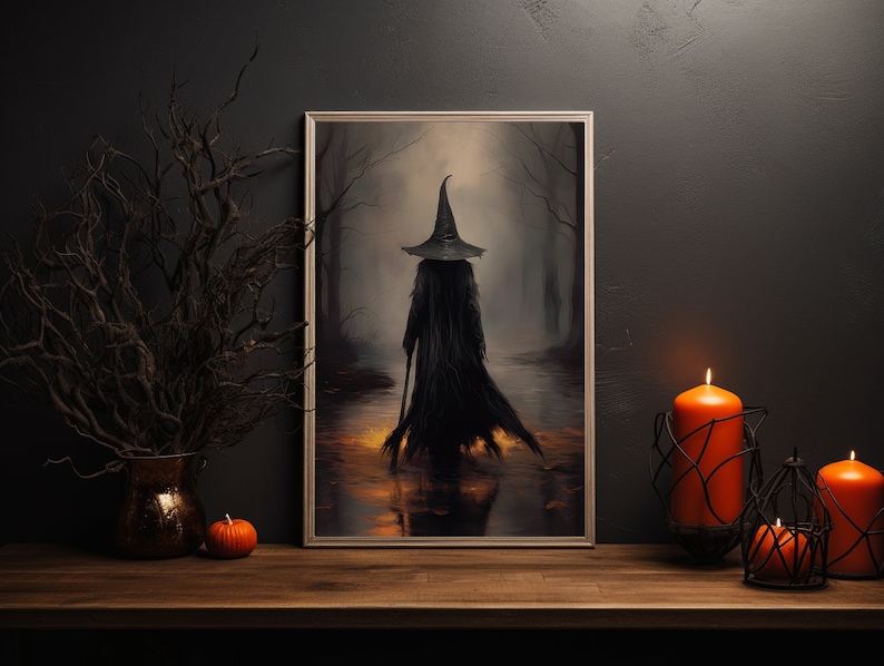 May include: A framed painting of a witch wearing a black pointed hat and robe, walking through a dark forest. The witch is holding a staff and the forest is lit by a warm glow.