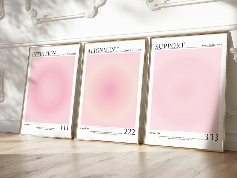 May include: Three framed pink and white gradient prints with gold frames. The prints have the words "Intuition", "Alignment", and "Support" at the top and the angel numbers 111, 222, and 333 at the bottom.