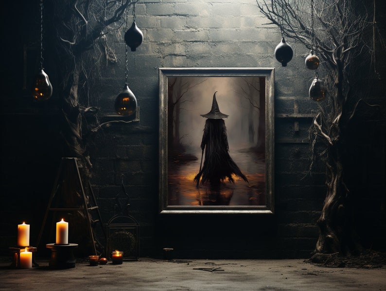 May include: A framed painting of a witch in a black cloak and pointed hat walking through a dark forest. The painting is hanging on a brick wall with two bare branches on either side.