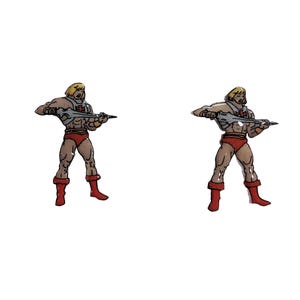 May include: Two enamel pins featuring a cartoon image of He-Man, a muscular man with blond hair, wearing a red loincloth and a silver breastplate, holding a sword in his right hand.