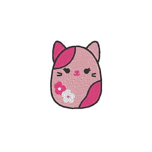 May include: Embroidered pink cat design with dark pink accents and a floral embellishment. The cat has a smiling face with black eyes and whiskers. The design is on a white background.