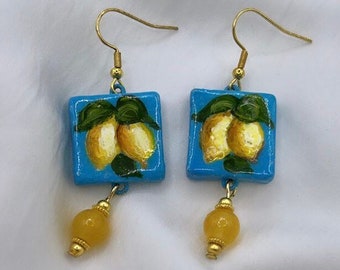 "Lemons from the coast" earrings on a light blue background, hand-painted Italian jewels, light, elegant, unique, original as a gift