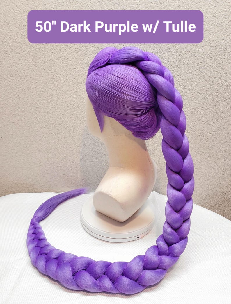 May include: A 50-inch dark purple wig styled with a large, thick braid that starts at the crown and extends downward. The wig is displayed on a mannequin head. The text 50" Dark Purple w/ Tulle is visible at the top of the image.