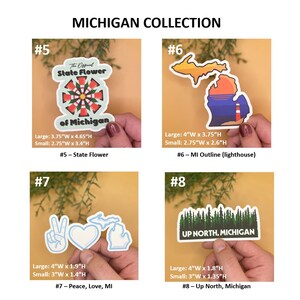 May include: A set of four Michigan-themed stickers. The stickers feature a state flower, a state outline with a lighthouse, a peace sign with a heart and a Michigan outline, and a forest scene with the text "Up North, Michigan".