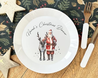 Première assiette de Noël personnalisée. Le père Noël et le renne ou l'ours de Noël créent des assiettes de Noël pour enfants.