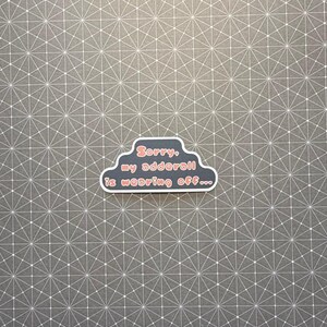 May include: A sticker in the shape of a cloud with the text "Sorry, my adderall is wearing off..." in red and white. The sticker is on a gray background with a white geometric pattern.