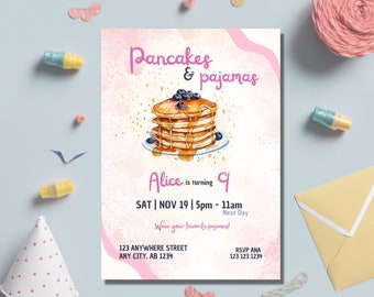 May include: A pink and white invitation with a watercolor illustration of a stack of pancakes with blueberries and syrup. The text reads "Pancakes & Pajamas Alice is turning 9 SAT | NOV 19 | 5pm - 11am Next Day Wear your favorite pajamas! 123 ANYWHERE STREET ANY CITY, AB 1234 RSVP ANA 123 123 1234"