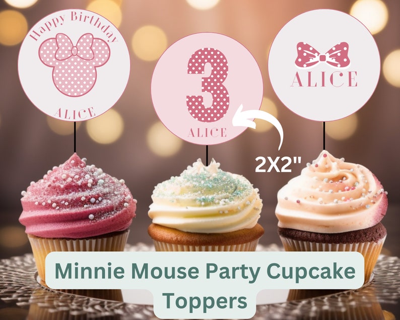 May include: Three pink and white cupcake toppers featuring a Minnie Mouse head with a bow, the number 3, and a bow with the name "Alice". The toppers are 2 inches by 2 inches and are shown on top of cupcakes.