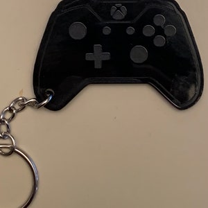 game controller X - Black acrylic keychain