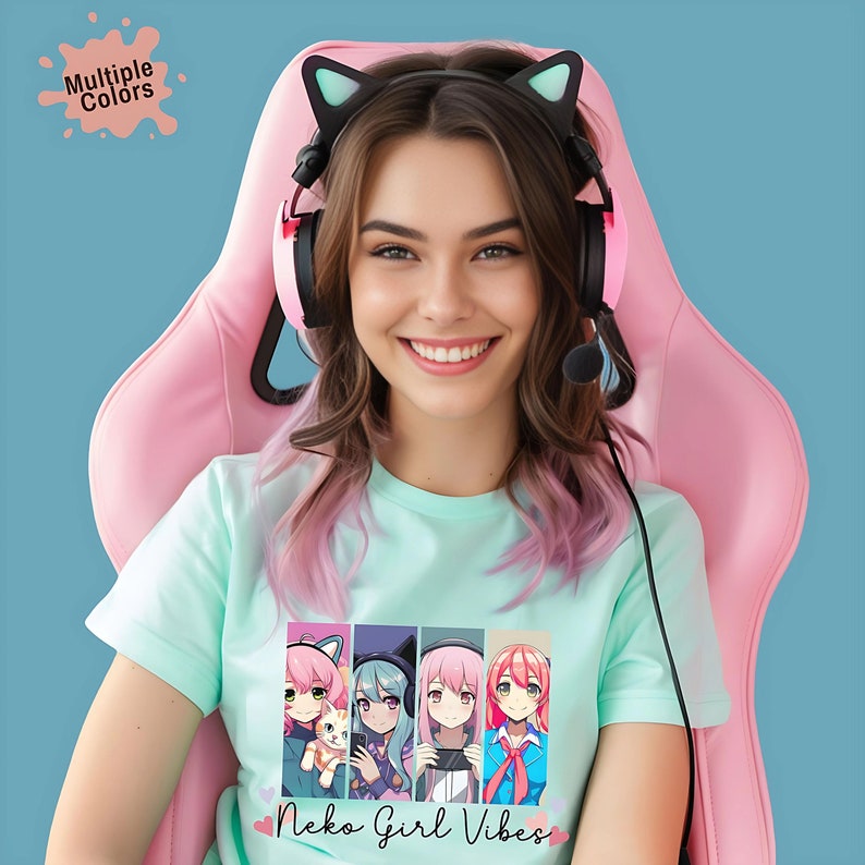 An anime-themed T-shirt features four cute Neko girls in vibrant colors, phrase under graphic is "Neko Girl Vibes". Made from soft, breathable fabric. Ideal for anime lovers and perfect for casual wear or as a unique gift.