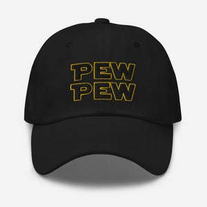 May include: Black baseball cap with the embroidered text "PEW PEW" in yellow. The hat has a curved brim and a structured fit, suitable for casual wear. The design is a playful reference to a popular science fiction theme.