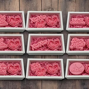 a box of valentine's day chocolates on a wooden table