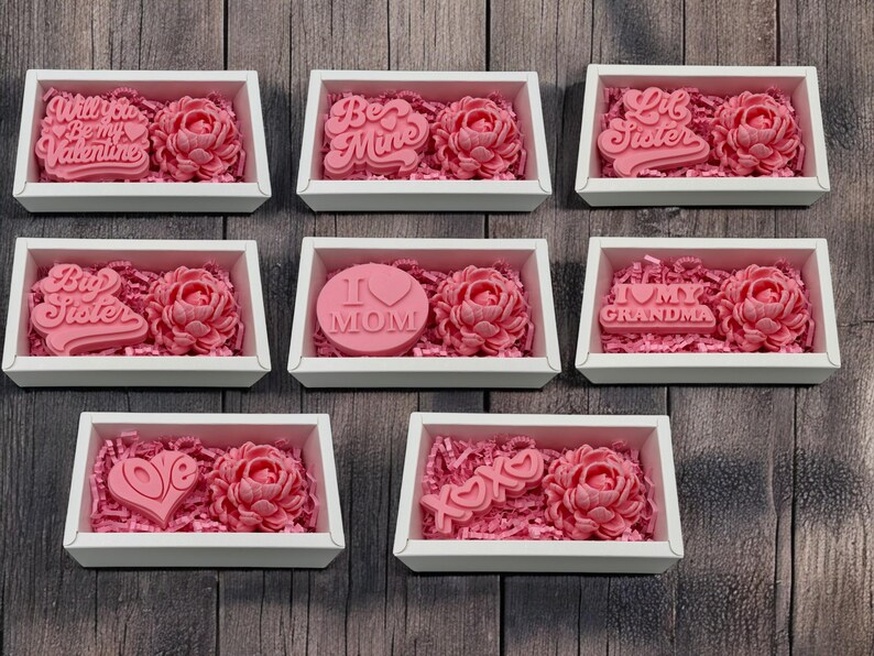 a bunch of pink roses in a white box