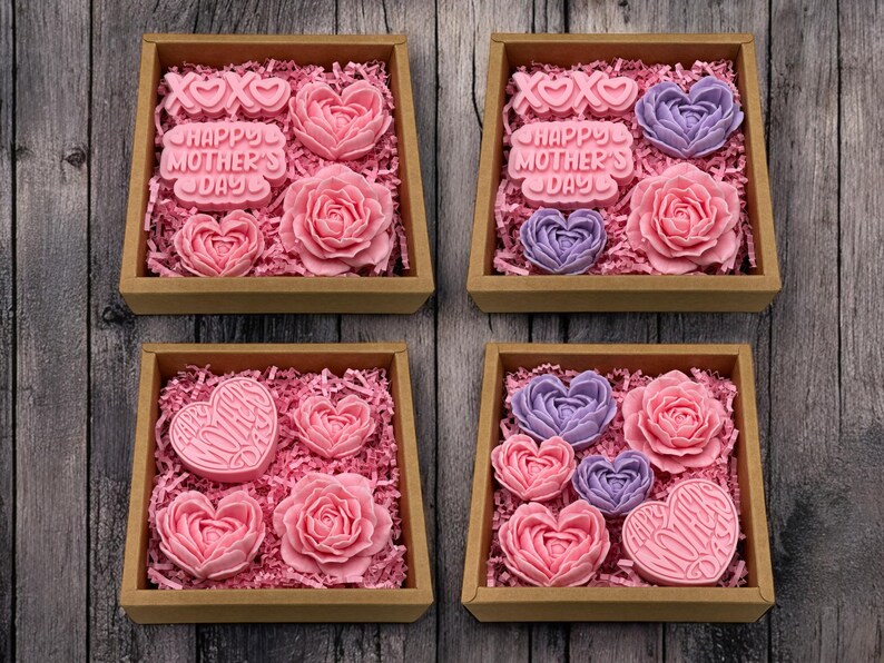 a box filled with pink and purple cupcakes