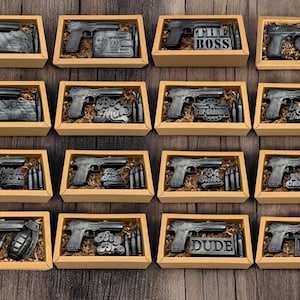 a bunch of guns in a box on a table
