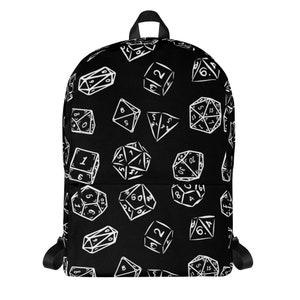 May include: Black backpack with a white dice pattern. The dice are various shapes and sizes and have numbers on them.