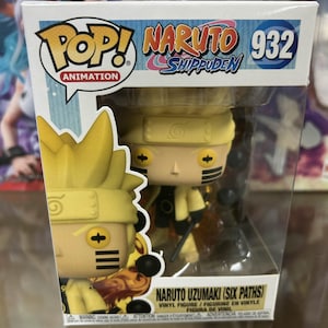 May include: A Funko Pop! Animation vinyl figure of Naruto Uzumaki in his Six Paths Sage Mode. The figure is yellow with black markings and has a red and orange flame effect around it. The box is yellow and black with the words "Naruto Shippuden" and "932" on it.