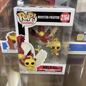 May include: A Funko Pop! vinyl figure of Rooster Fighter Keiji with Piyoko. The figure is in a clear plastic display case. The box art features a rooster with red and white feathers and a small yellow chick.