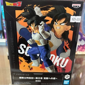May include: A Dragon Ball Z figure of Goku in his Super Saiyan form. The figure is posed in a fighting stance with his fist raised. The figure is made of plastic and is approximately 6 inches tall. The figure is packaged in a box with a picture of Goku on the front. The box also includes the text "Dragon Ball Z" and "Super Saiyan Goku".