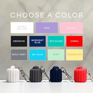 May include: Choose a color for your Airpods case.  The colors shown are Marsh Mallow, Taro, Sakura, Obsidian, Midnight Blue, Sea Glass, Coral, Wolf Grey, Sky Blue, Mint, and Dandelion.