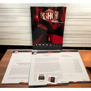 May include: A promotional display for the Showtime Originals series, "Frankie and Hazel." The display includes a large poster with the show's logo and several printed sheets with show information and credits. The color scheme is primarily red and black.