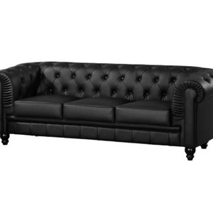 May include: A black leather tufted sofa with rolled arms and wooden legs.