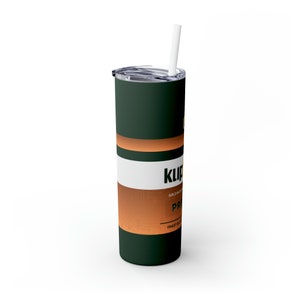 May include: A green and copper stainless steel tumbler with a white stripe and the text "Klip" in gold lettering. The tumbler has a white straw.