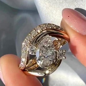 3 Carat Pear Moissanite Bridal Set | Unique Swirl Engagement Ring with Matching Band | 14K Yellow Gold | Bypass Statement Bridal Jewelry