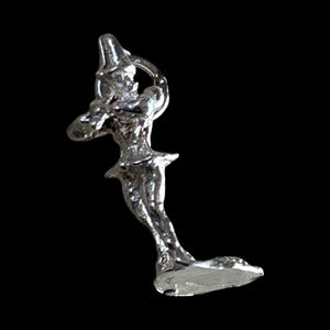 May include: A silver-colored figurine of a person holding a bow and arrow, poised as if ready to shoot. The figure is wearing a hat and a short skirt. The background is solid black.