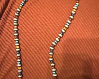 Faux Navajo pearl beads with natural Heishi crystal agate disk beads. Colors of blue, gold, rust and turquoise. SO versatile.