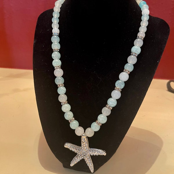 Starfish necklace. 18” long with 2 1/2” extension. Large 2” Starfish pendant  with rhinestones. Necklace is pale blue and clear glass beads