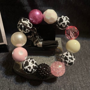 Bubblegum big bead wristlet keychain “Strawberry milkshake” cow print, pink, white, black