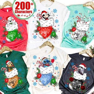 May include: A collection of Christmas-themed t-shirts in various colors, each featuring a different cartoon character inside a Christmas stocking. The shirts are red, white, teal, green, and charcoal. The text "200+ Characters" is in a circle at the top.