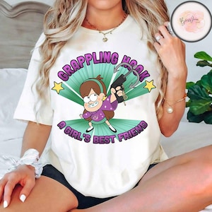 Camiseta com logotipo do gancho de escalada da Disney Gravity Falls Mabel Pines, camiseta de férias da Disneylândia combinando com a família, presentes de aniversário para viagem Disney WDW