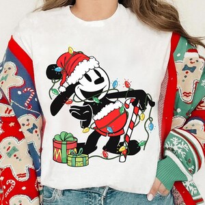 Disney Epic Mickey Oswald The Lucky Rabbit Christmas Lights Shirt, Santa Oswald Mickey T-shirt, Mickey&#39;s Very Merry Christmas Party 2025