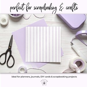 May include: A square paper with vertical white and lavender stripes is the focal point of this image. Other craft supplies include scissors, tape, ribbon, and a container. The text "perfect for scrapbooking & crafts" is at the top.