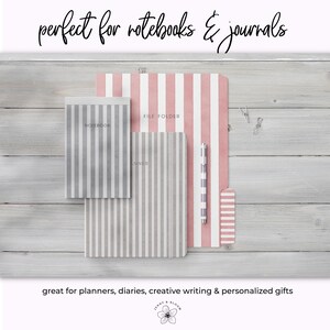 May include: A collection of striped notebooks, a file folder, and a pen. The notebooks and file folder have vertical stripes in gray and white, and pink and white. The pen has a matching striped design. The text "perfect for notebooks & journals" is at the top.