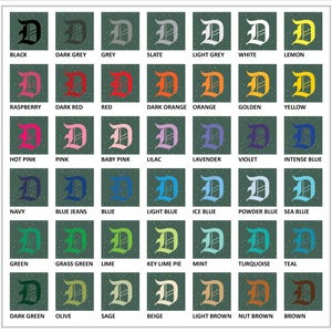 May include: A grid of color swatches, each featuring a stylized letter "D" in various shades. Colors include black, grey, red, orange, yellow, pink, blue, green, and brown, with names like "Raspberry," "Teal," and "Nut Brown."