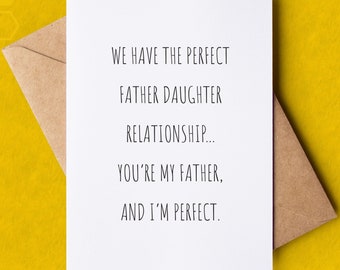 May include: A white card with black text that reads "We have the perfect father daughter relationship... You're my father, and I'm perfect." The card is in a brown envelope on a yellow background.