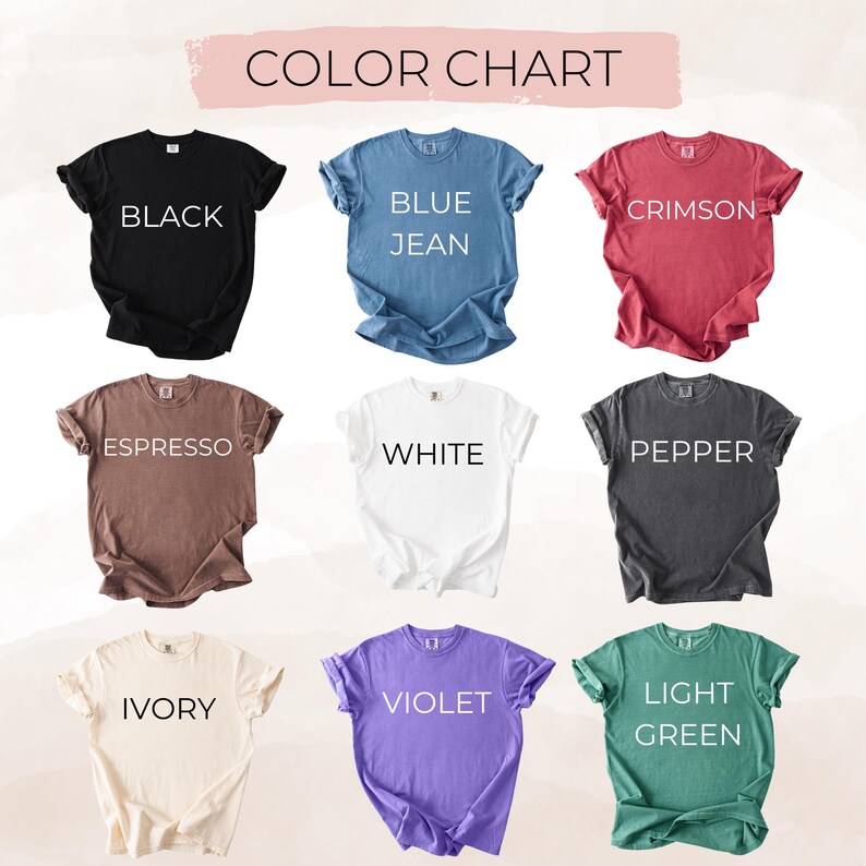 May include: A color chart displays nine t-shirts in various colors: black, blue jean, crimson, espresso, white, pepper, ivory, violet, and light green. Each shirt has its color name printed in white.