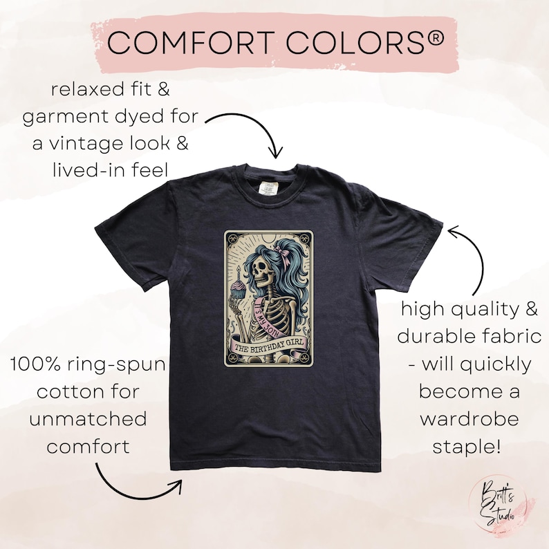 May include: Black t-shirt featuring a vintage-style illustration of a skeleton wearing a pink sash and holding a cupcake. The text on the illustration reads "The Birthday Girl". The shirt is made from 100% ring-spun cotton and has a relaxed fit.