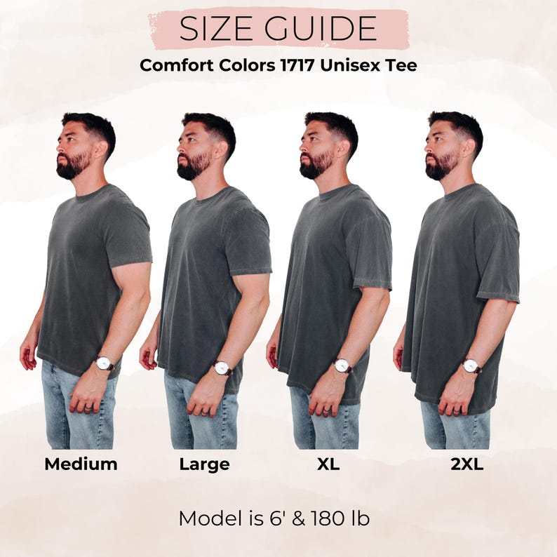May include: Size guide for Comfort Colors 1717 Unisex Tee. Four models wearing the tee in sizes Medium, Large, XL, and 2XL. The model is 6' and 180 lb. The tee is a dark gray color.