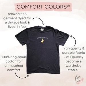 May include: A navy blue Comfort Colors t-shirt with the phrase "Off to get a little silly" and a cartoon duck graphic. The shirt is made of 100% ring-spun cotton and has a relaxed fit for a vintage look and feel.