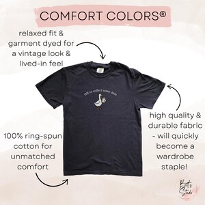 May include: Dark navy blue t-shirt with the text "Off to collect some data" and a cartoon goose carrying a coffee cup. The shirt is made of 100% ring-spun cotton and has a relaxed fit. The shirt is garment dyed for a vintage look.