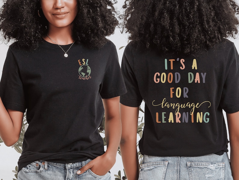 May include: Black t-shirt with the text "ESL teacher" and a globe graphic on the front. The back of the shirt has the text "It's a good day for language learning" in colorful letters.